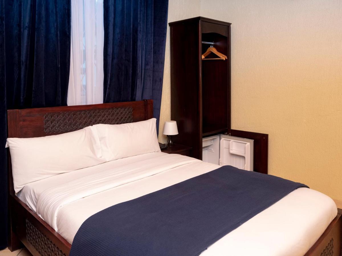 The Haven Boutique Hotel คูมาซี ภายนอก รูปภาพ